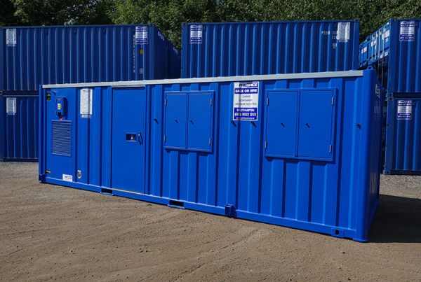 Blue welfare unit with other similar units stacked in the background