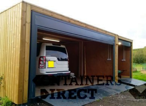 A shipping container garage conversion clad in wood