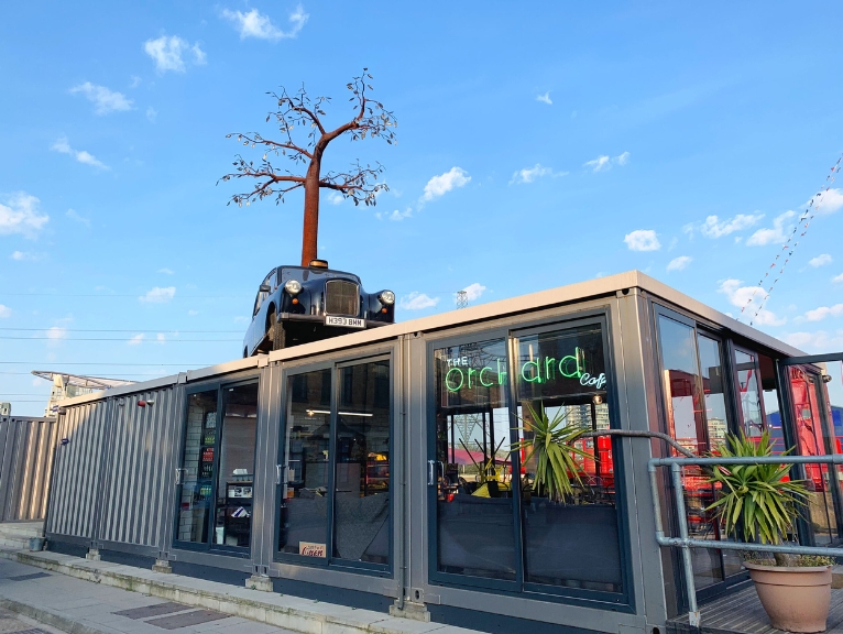 Exterior shot of the Orchard Cafe in London using a container