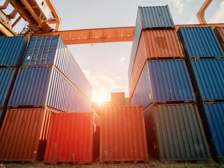 Photograph of shipping containers overheating in the sun