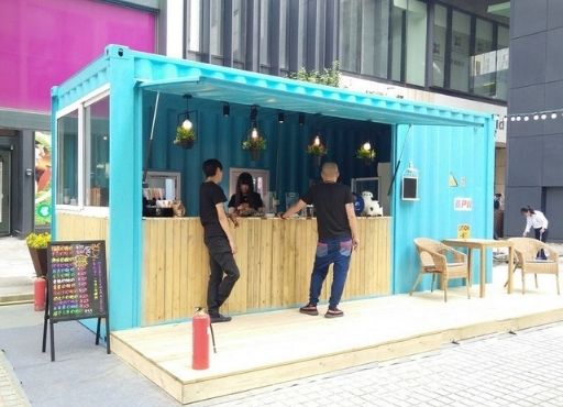 A turquoise food stall made from a shipping container