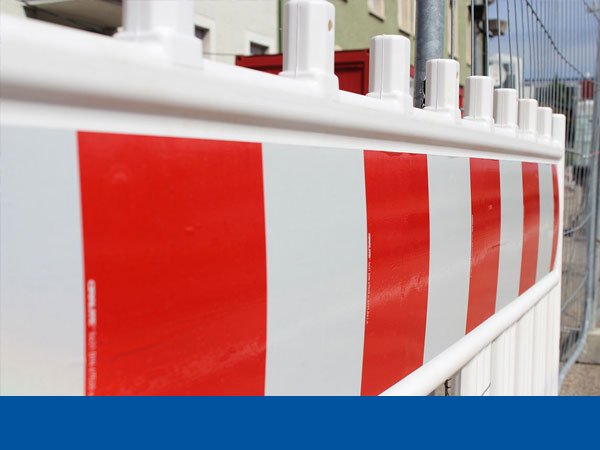 A red and white construction site fence