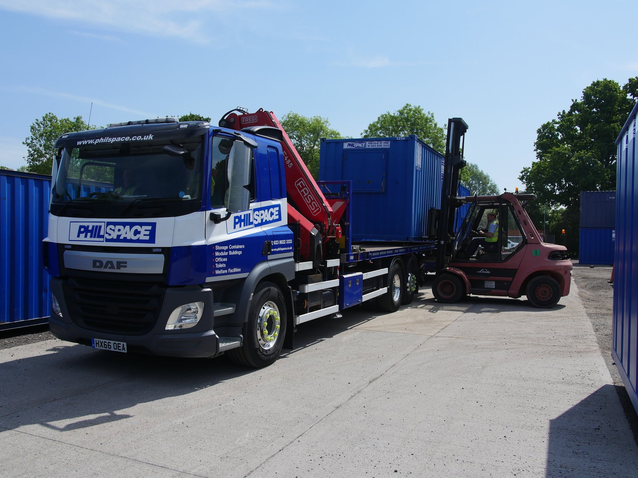 A Philspace lorry gets loaded up with a container ready for delivery