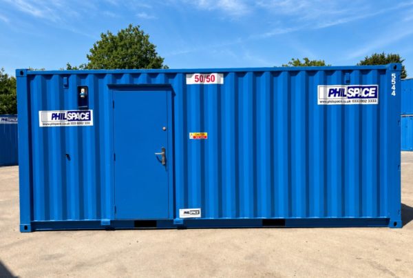 Is a 50 50 store right for your project — A blue shipping container conversion with a single door, branded with PhilSpace signage and a "50/50" label, set on a construction yard.