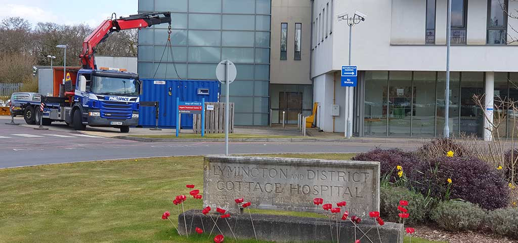 Welfare unit to be used as a testing pod being placed outside the Lymington NHS hospital