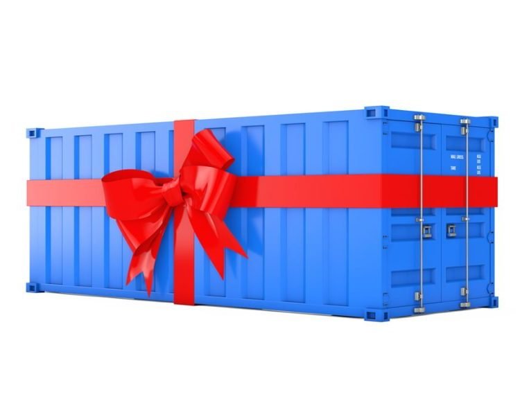 a blue shipping container wrapped in a read ribbon with bow